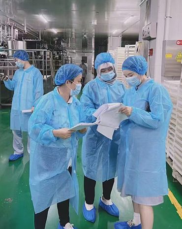 Automated dietary supplement production line inside a cGMP cleanroom